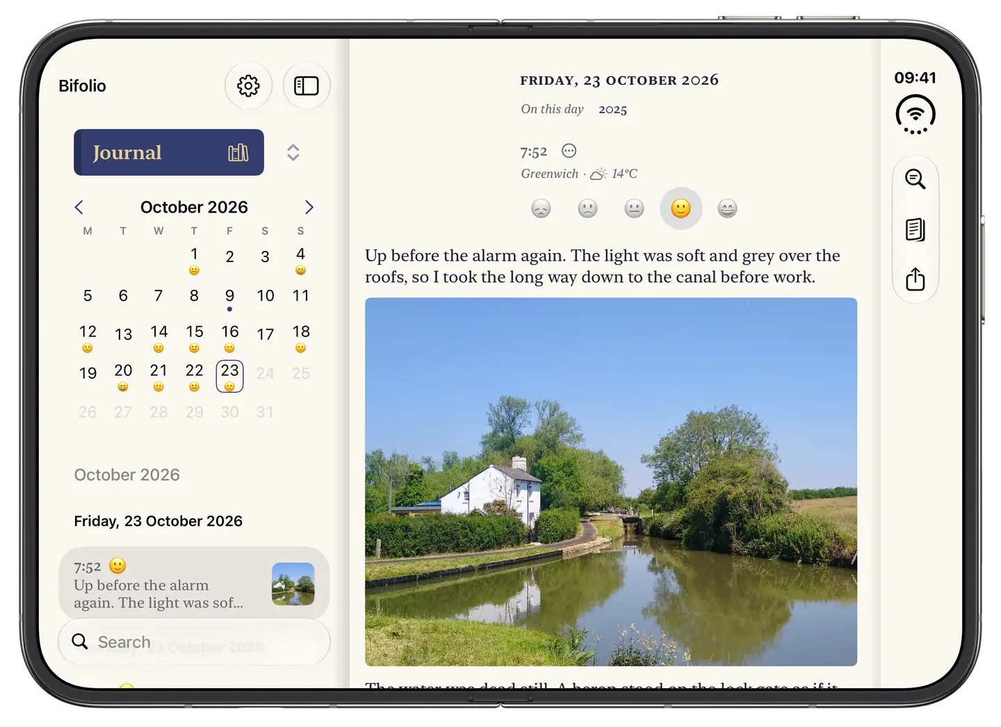 Bifolio open on iPhone Duo: the October calendar and the day’s entries on the left, and Friday 23 October’s entry, with a photo of a cottage by a canal, on the right.