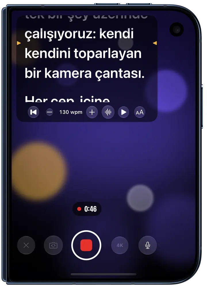 Katlı bir iPhone Duo dış ekranında kayıt yapan Eyeline: ön kameranın hemen altında Türkçe metin, okunacak satır kehribar renginde işaretli, hız dakikada 130 kelime, çekim 0:46’da.