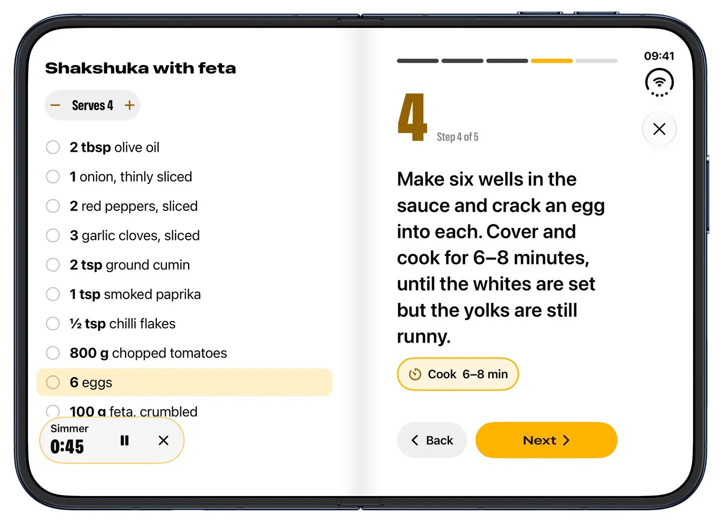 Spread open on iPhone Duo in cook mode: the shakshuka’s ingredients on the left page with the eggs highlighted, step 4 in large type on the right, and a Simmer timer running.